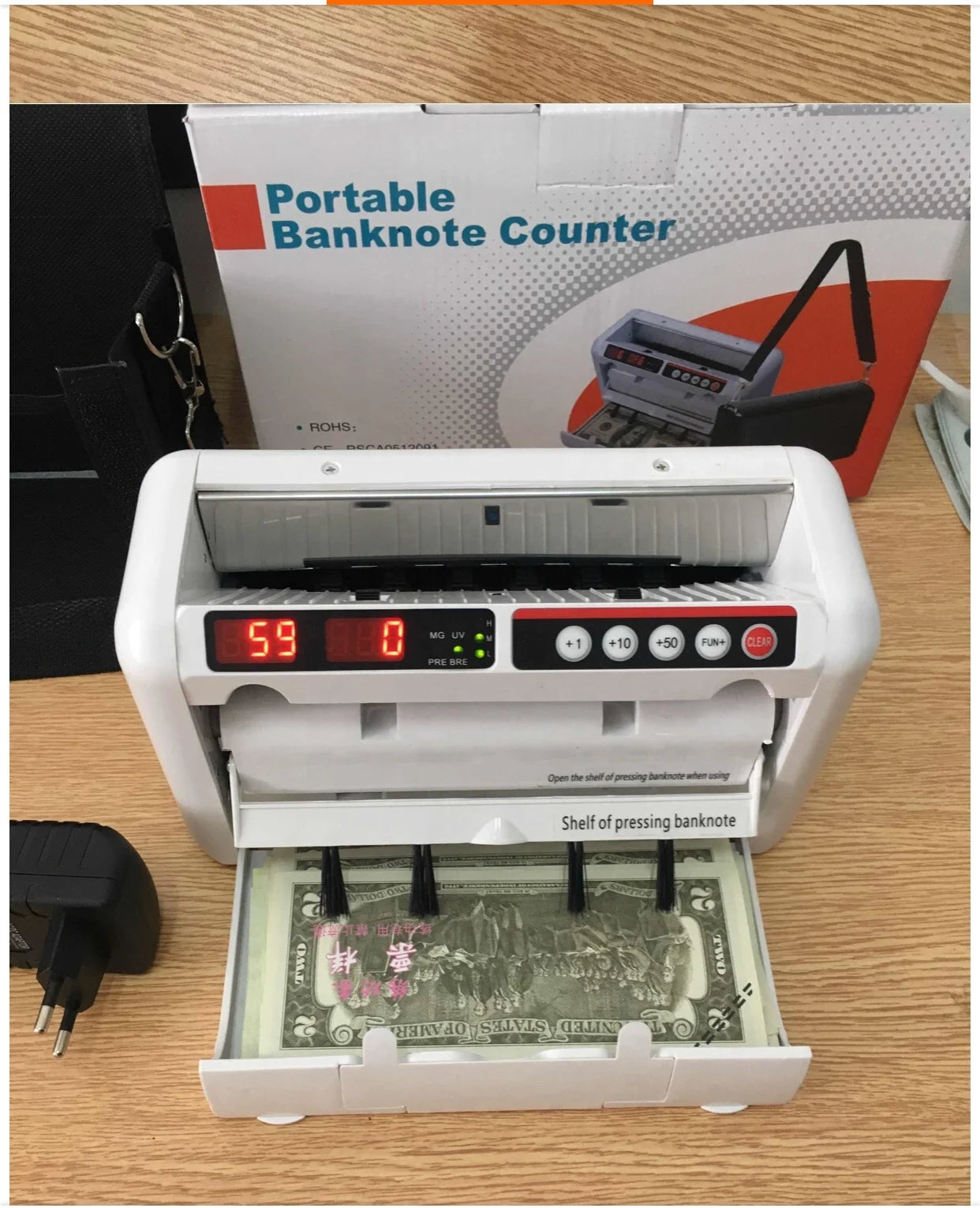 آلة عد النقود المحمولة